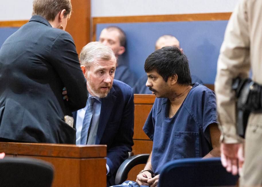 Shiva Gummi, right, listens to his attorneys Katherine Currie-Diamond, left, and David Westbroo ...