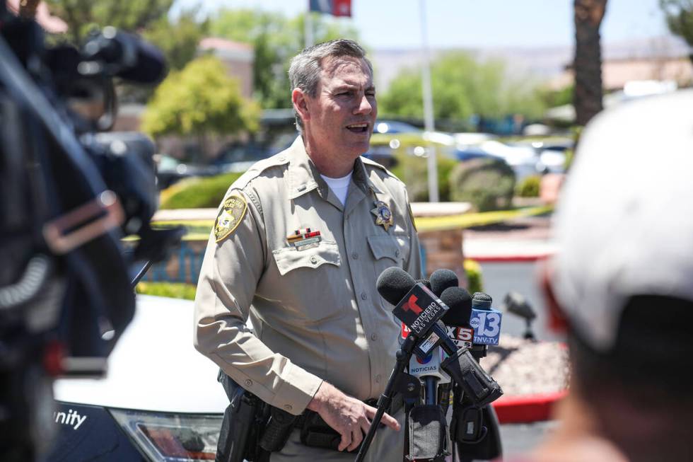 Metro homicide Lt. Jason Johansson addresses the media at the scene of a homicide at an apartme ...