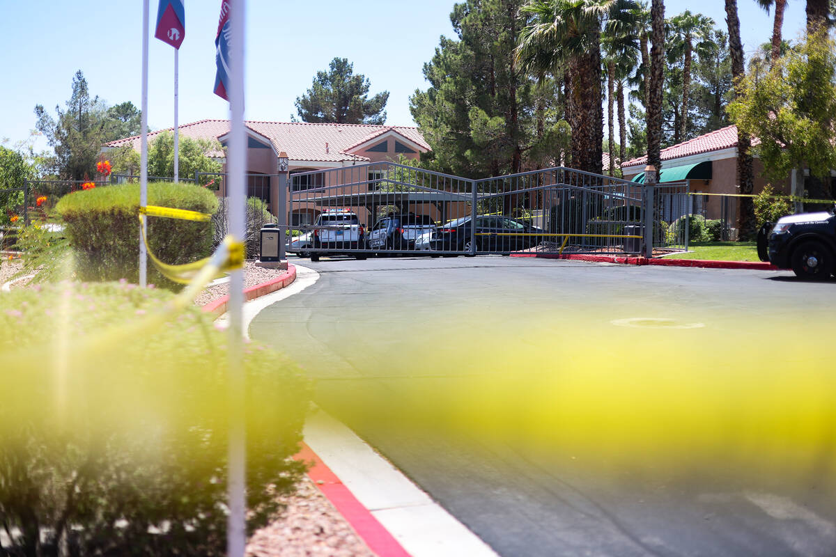 Police at the scene of a homicide at an apartment complex where three people were killed in wes ...