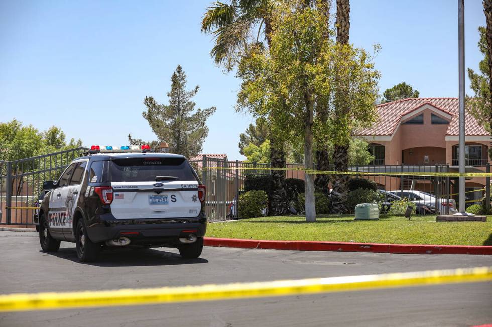 Police at the scene of a homicide at an apartment complex where three people were killed in wes ...