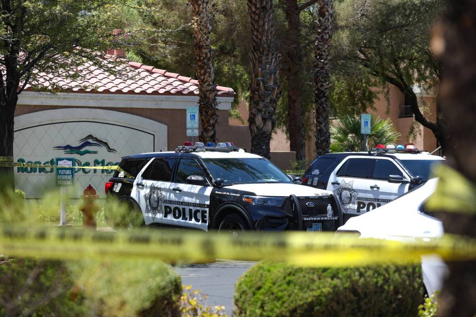 Police at the scene of a homicide at an apartment complex where three people were killed in wes ...