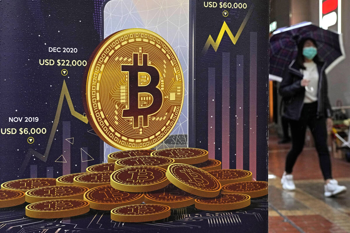 An advertisement for Bitcoin cryptocurrency is displayed on a street in Hong Kong on Thursday, ...