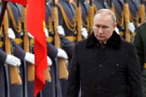 FILE - Russian President Vladimir Putin attends a wreath-laying ceremony at the Tomb of the Unk ...