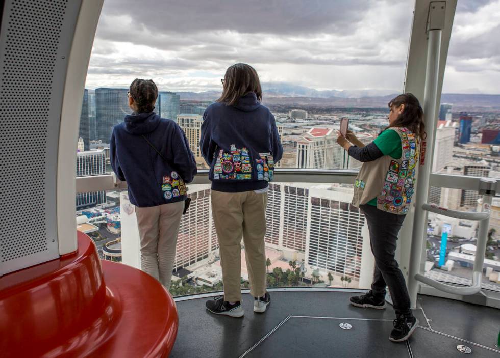 Las Vegas Girl Scouts, from left, Rhealyn, Laila and Noel ride the High Roller as a part of a S ...