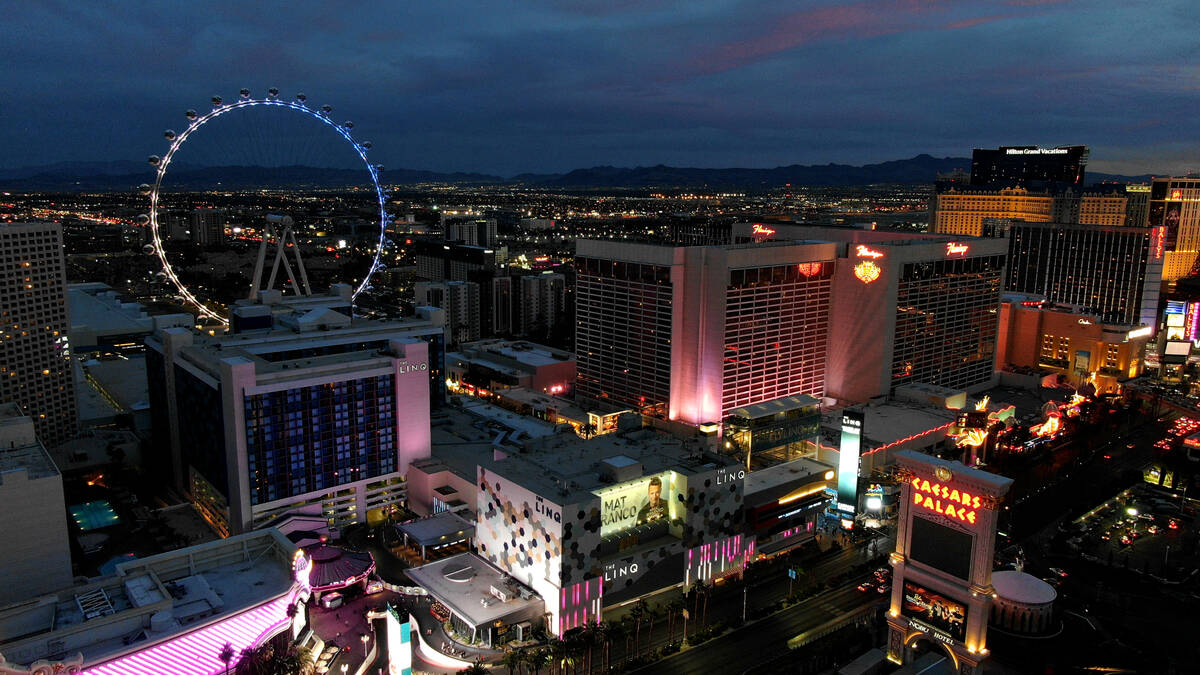 Aerial view of The Linq and Flamingo hotel casinos on the central Las Vegas Strip at sunset on ...