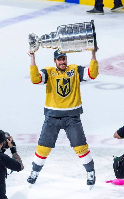 Golden Knights right wing Reilly Smith (19) hoists the Stanley Cup after defeating the Florida ...