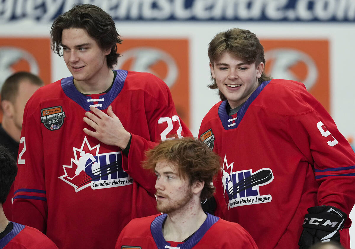 Halifax Mooseheads' Mathieu Cataford, back left, Winnipeg Ice's Zach Benson, back right, and Fl ...
