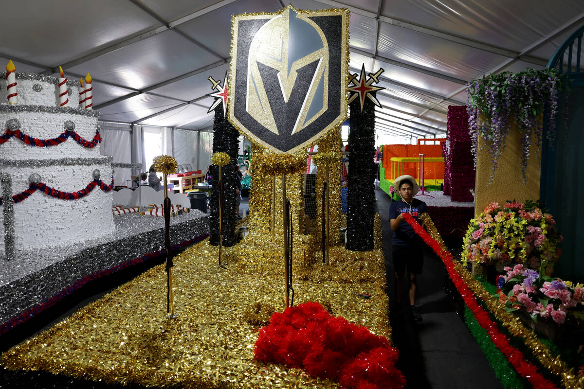Volunteer Samuel Lin works on the Vegas Golden Knights float for the 29th annual Summerlin Coun ...