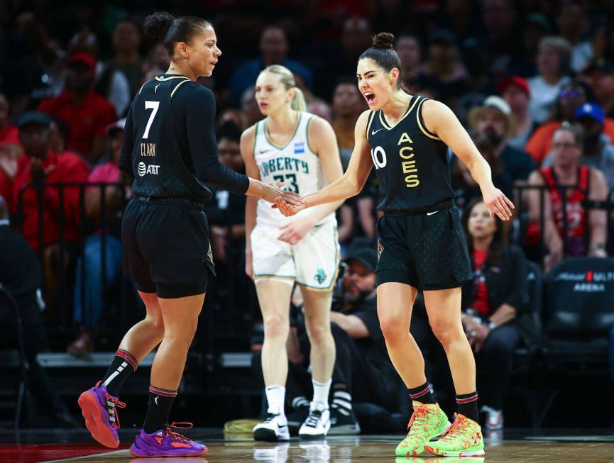 Las Vegas Aces forward Alysha Clark (7) and guard Kelsey Plum (10) celebrate after the New York ...