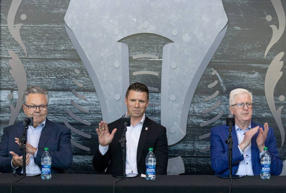 Ryan Craig, center, the new Silver Knights head coach, waves to attendees after being introduce ...