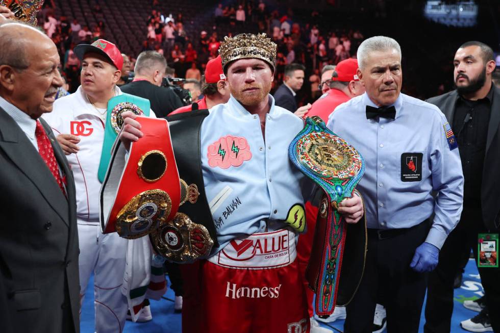 Saul "Canelo" Alvarez poses with his championship belts after his unanimous decision ...