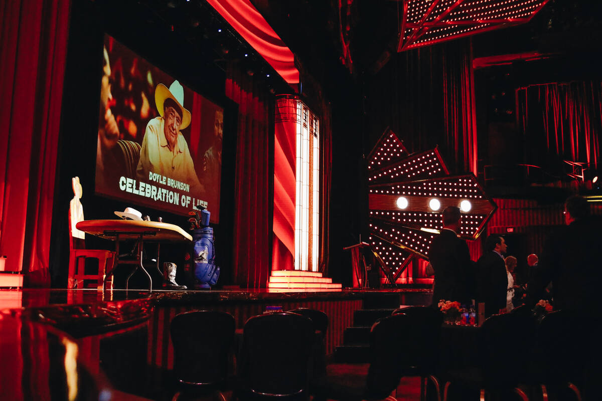 A photograph of poker legend Doyle Brunson is shown on a screen before the beginning of a celeb ...
