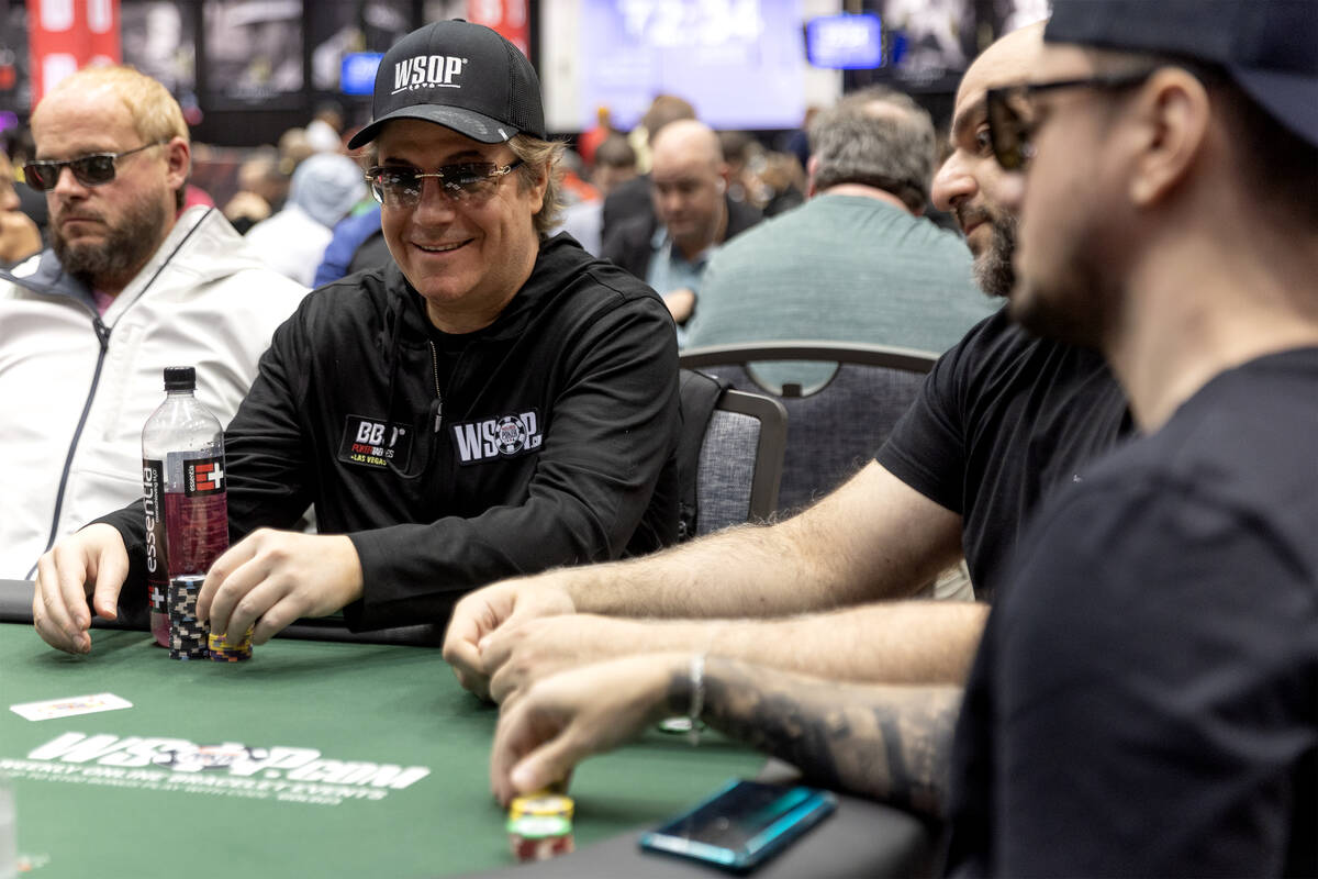Jamie Gold, center, plays during the World Series of Poker $10,000 buy-in No-limit Hold’em Wo ...
