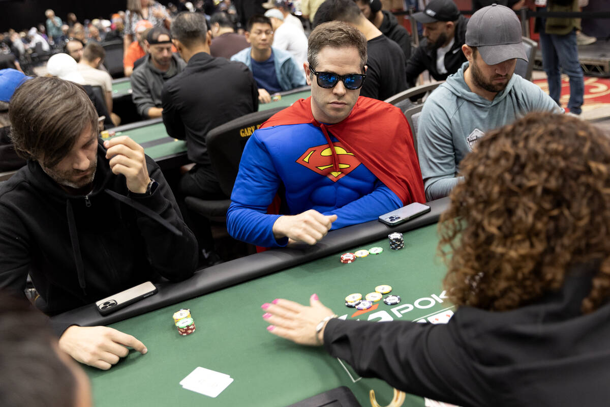 A player wears a Superman suit during the World Series of Poker $10,000 buy-in No-limit Hold&#x ...