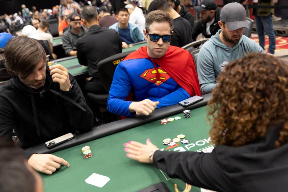 A player wears a Superman suit during the World Series of Poker $10,000 buy-in No-limit Hold&#x ...