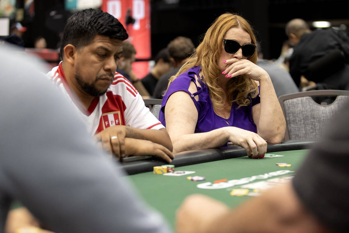 Players concentrate on their game during the World Series of Poker $10,000 buy-in No-limit Hold ...