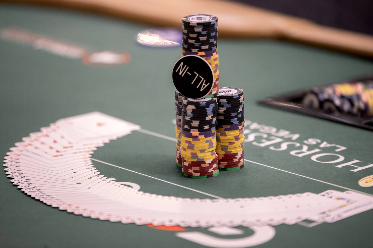 Cards and chips are ready at a table during the World Series of Poker $10,000 buy-in No-limit H ...