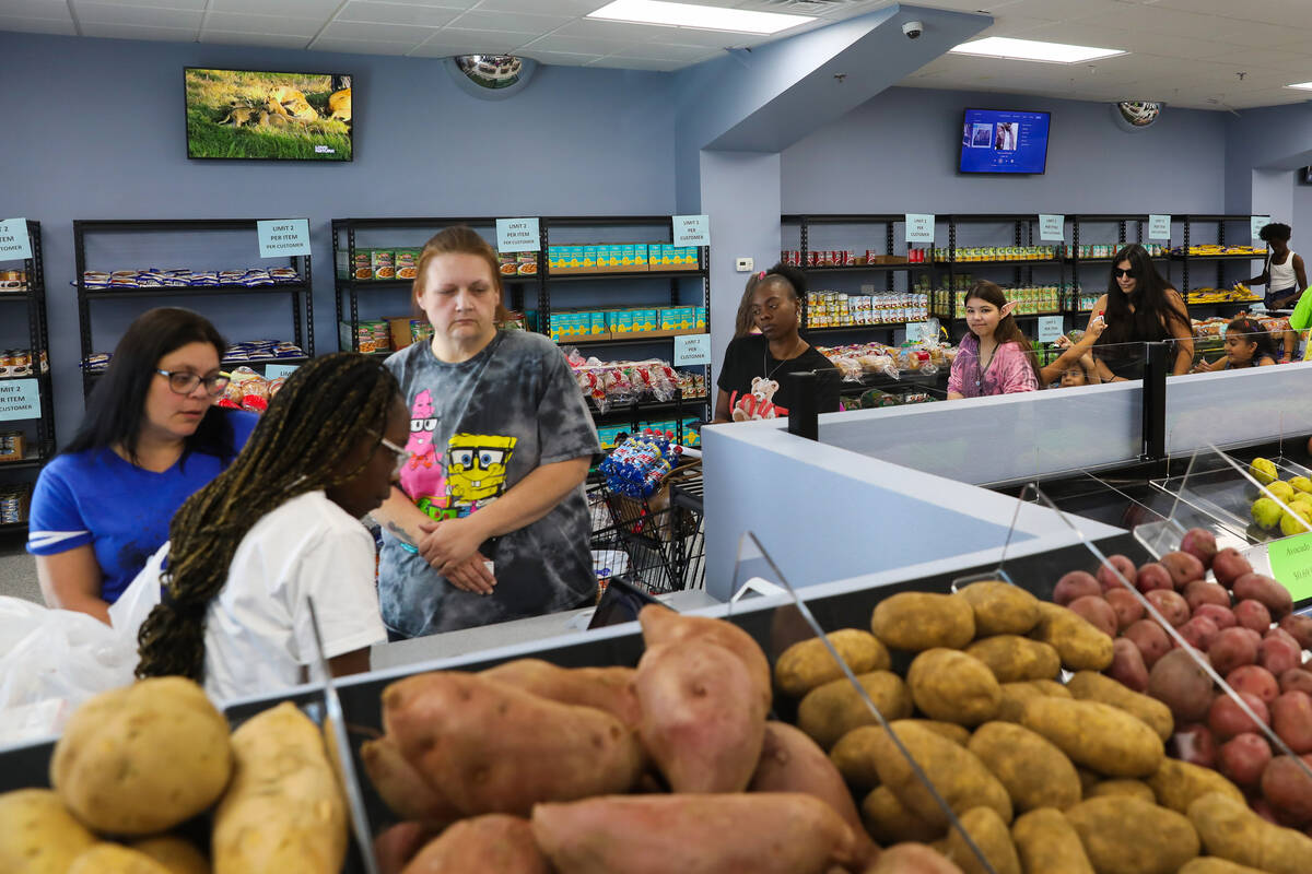 Customers line up throughout the store at The After Market to check out on Thursday, June 22, 2 ...