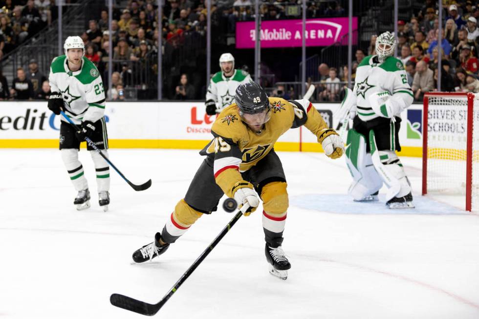 Golden Knights center Teddy Blueger (53) reaches for a loose puck during the third period in Ga ...