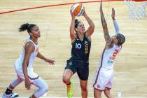 Las Vegas Aces guard Kelsey Plum (10) elevates to shoot over Connecticut Sun guard Natisha Hied ...