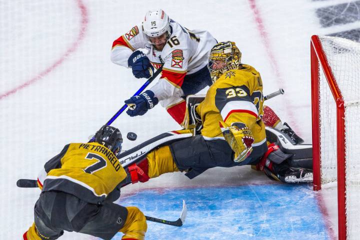 Golden Knights goaltender Adin Hill (33) saves a goal attempt by Florida Panthers center Aleksa ...