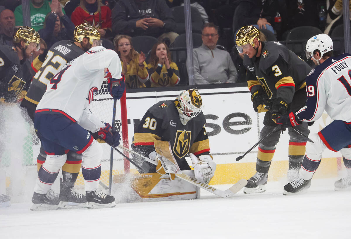 Golden Knights goaltender Jiri Patera (30) stops the puck against the Columbus Blue Jackets dur ...