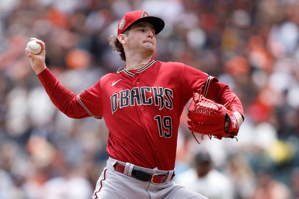 Arizona Diamondbacks starting pitcher Ryne Nelson throws during the first inning of a baseball ...