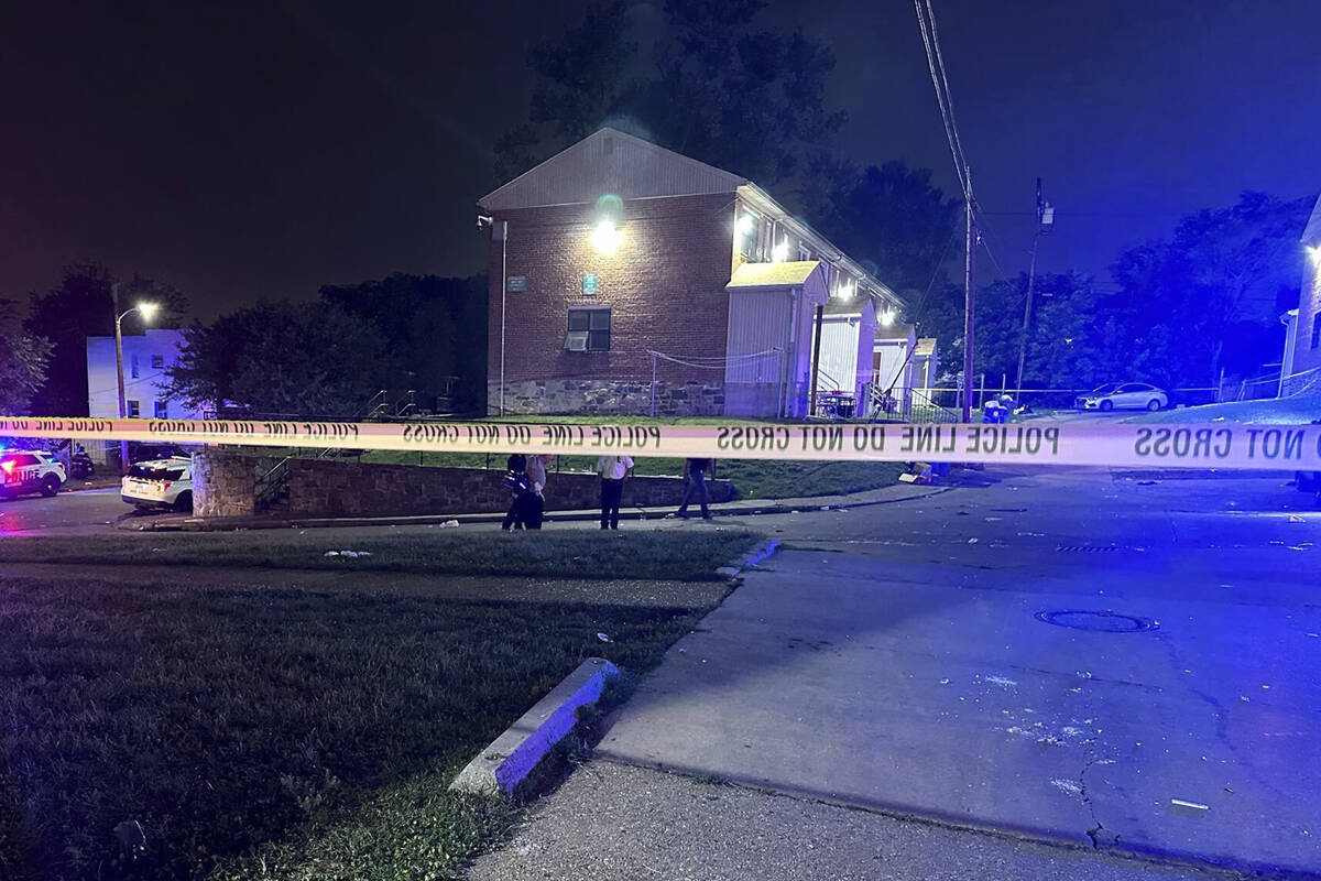 In this photo released by the Baltimore Police Department, police tape cordons off the area of ...