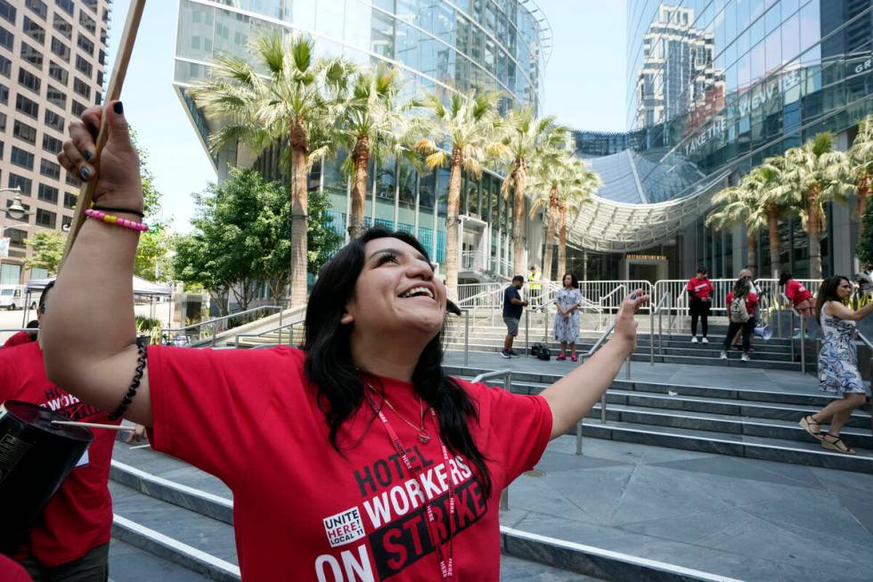 Striking hotel workers rally outside the Intercontinental Hotel after walking off their job ear ...