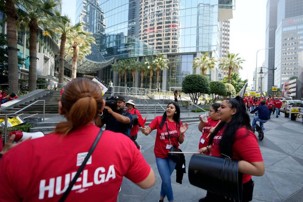 Striking hotel workers rally outside the Intercontinental Hotel after walking off their job ear ...