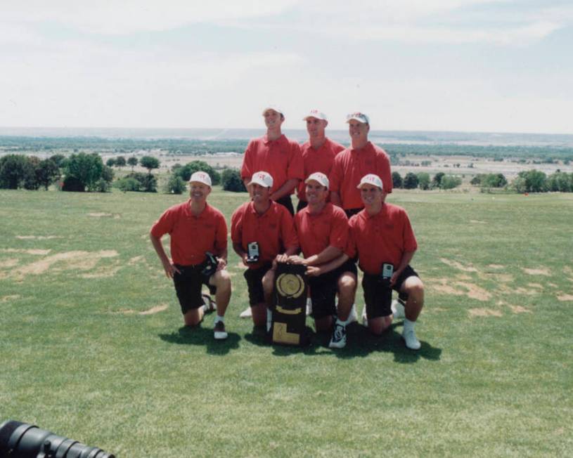 Members of the 1998 UNLV men's golf team with the NCAA championship trophy, front from left, co ...