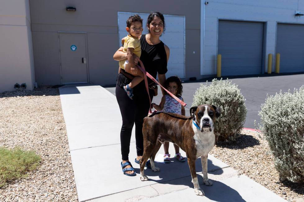 Erika Paola Ruelas, with her children Matthias, 1, and Khalessi, 2, pose for a photo after bein ...