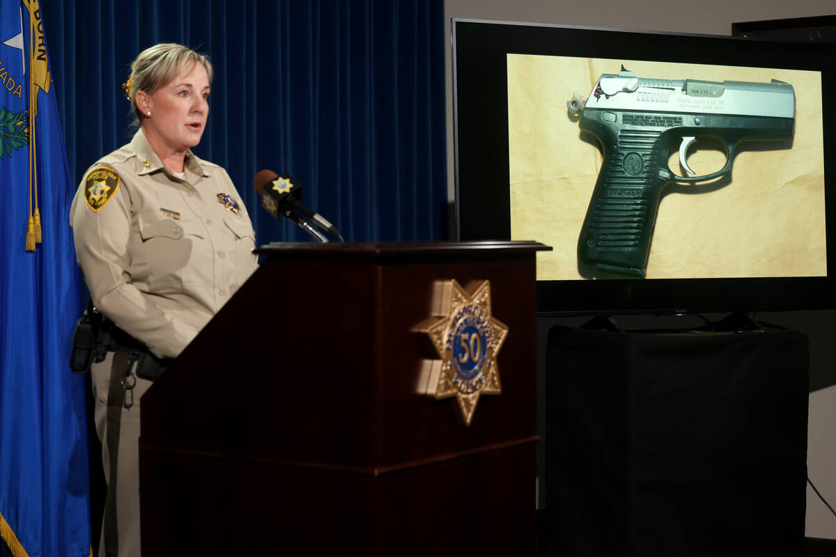 Assistant Sheriff Jamie Prosser shows a photo of a gun she said belonged to Jeffrey Hair at Met ...