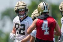 New Orleans Saints tight end Foster Moreau (82) talks with quarterback Derek Carr (4) during NF ...