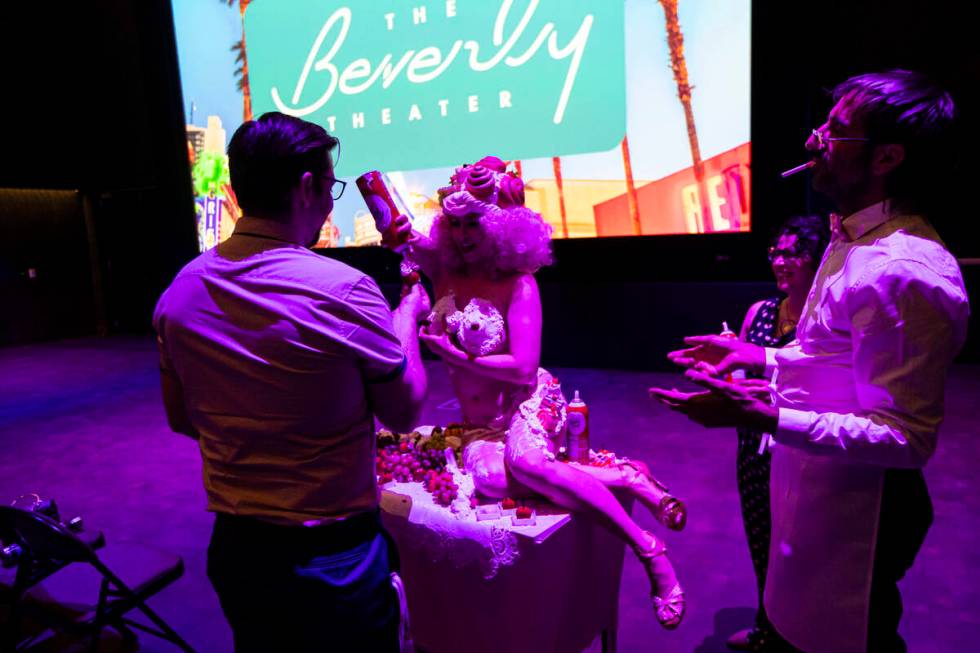 Burlesque artist Buttercup performs and feeds the crowd during the wrap party for the Sweets’ ...