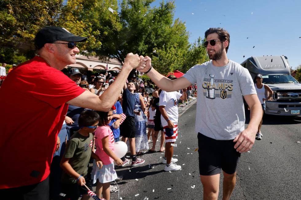 Golden Knights defenseman Nicolas Hague receives a high-five during the annual Summerlin Counci ...