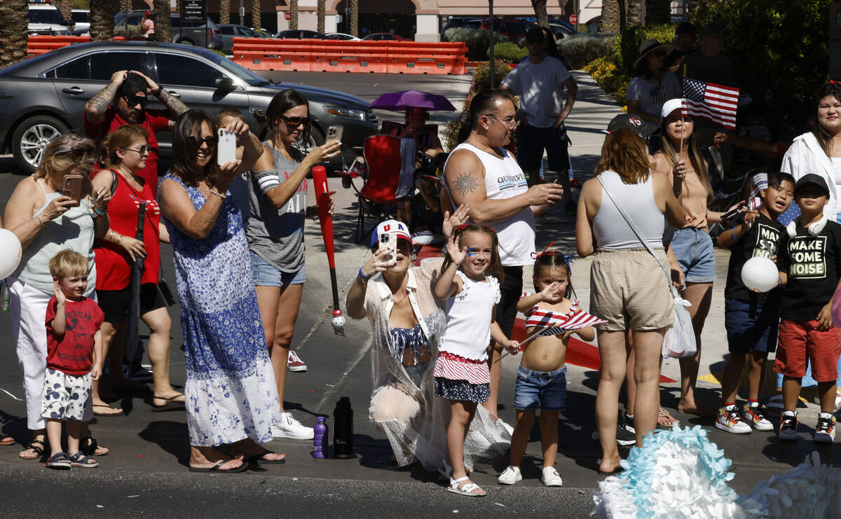 People cheer during the annual Summerlin Council Patriotic Parade, Tuesday, July 4, 2023, in La ...