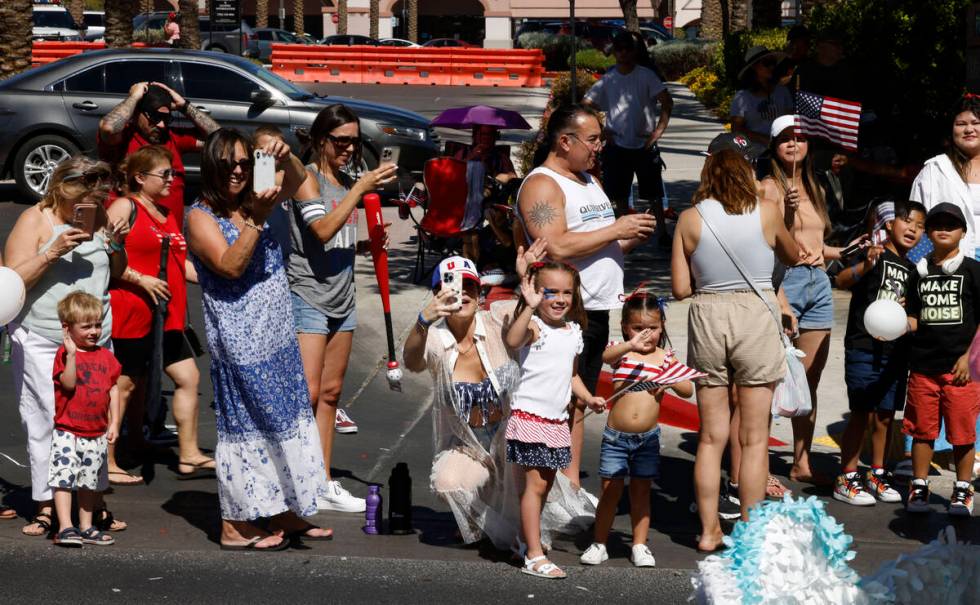 People cheer during the annual Summerlin Council Patriotic Parade, Tuesday, July 4, 2023, in La ...