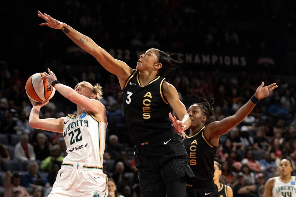 New York Liberty guard Courtney Vandersloot (22) shoots against Las Vegas Aces forward Candace ...