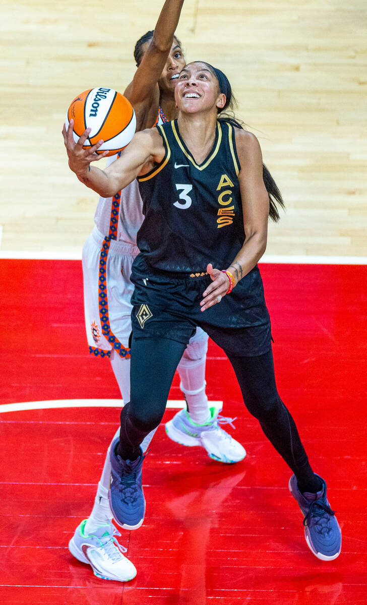 Las Vegas Aces forward Candace Parker (3) gets off a backwards shot past Connecticut Sun forwar ...