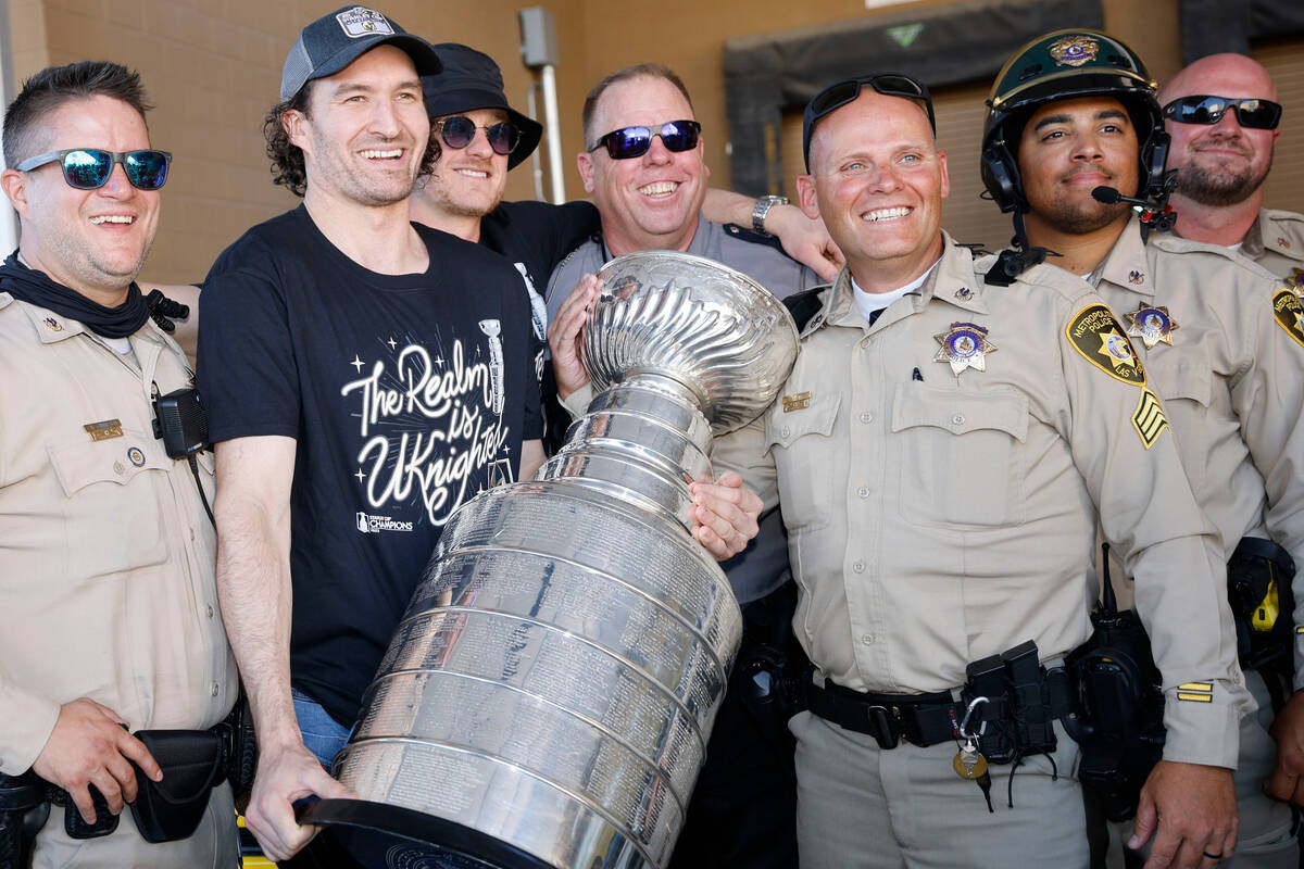 Golden Knights right wing Mark Stone poses for a photo with Las Vegas police officers before th ...