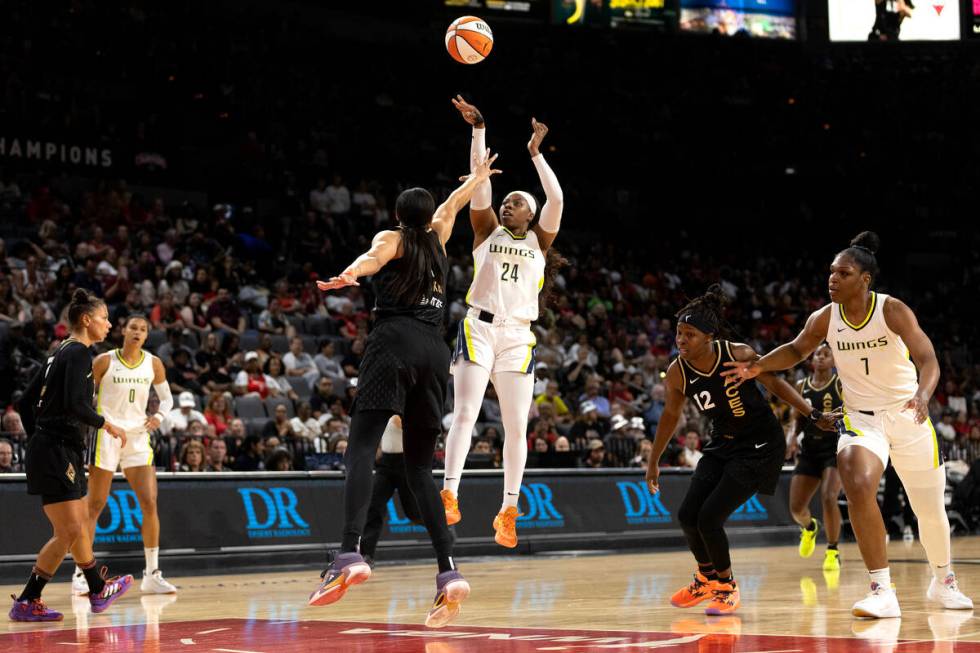 Dallas Wings guard Arike Ogunbowale (24) shoots against Las Vegas Aces forward Candace Parker ( ...