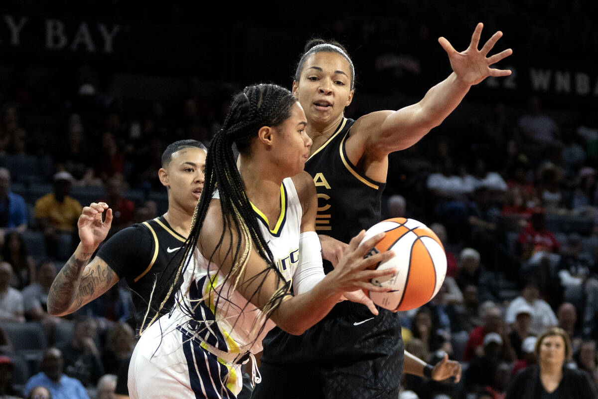 Las Vegas Aces center Kiah Stokes (41) reaches to block a pass by Dallas Wings forward Satou Sa ...