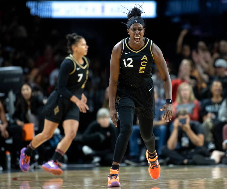 Las Vegas Aces guard Chelsea Gray (12) celebrates after scoring during the first half of a WNBA ...