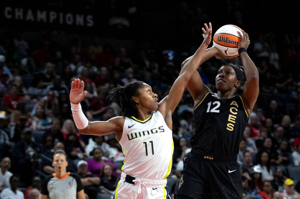 Las Vegas Aces guard Chelsea Gray (12) shoots against Dallas Wings guard Crystal Dangerfield (1 ...