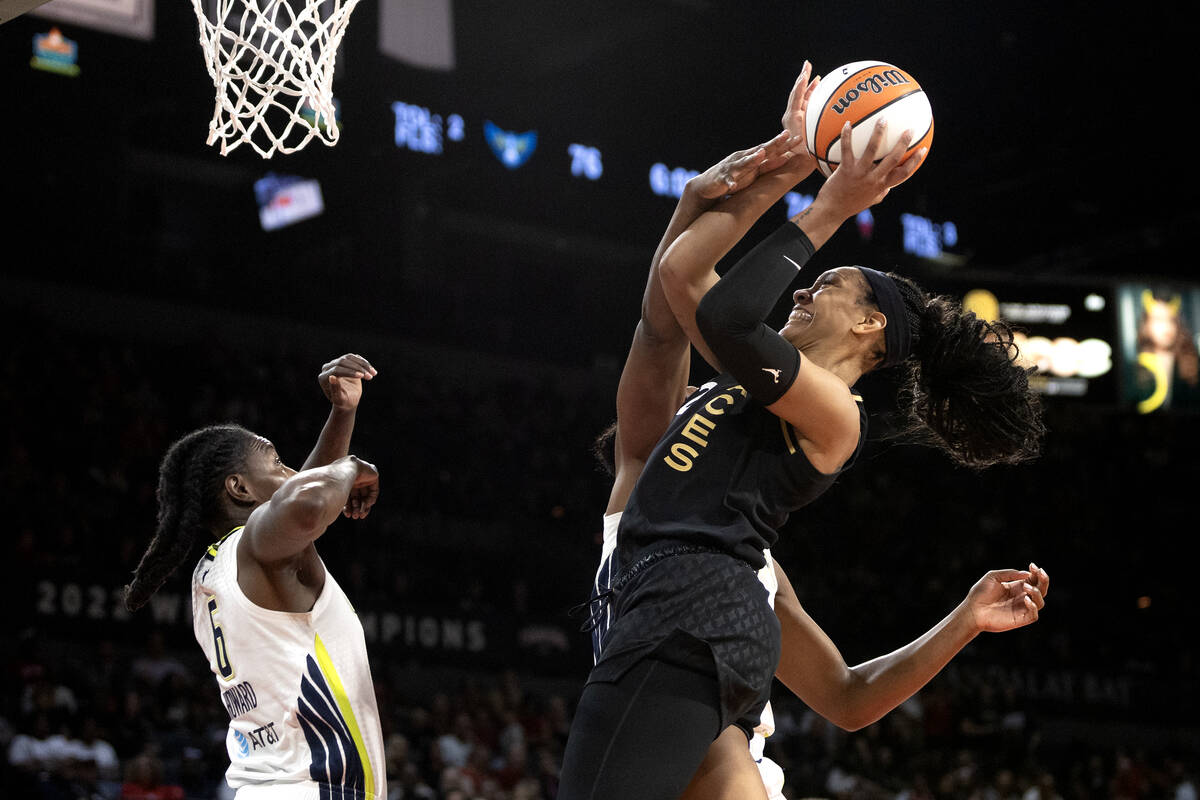 Las Vegas Aces forward A'ja Wilson (22) shoots against Dallas Wings forward Natasha Howard (6) ...