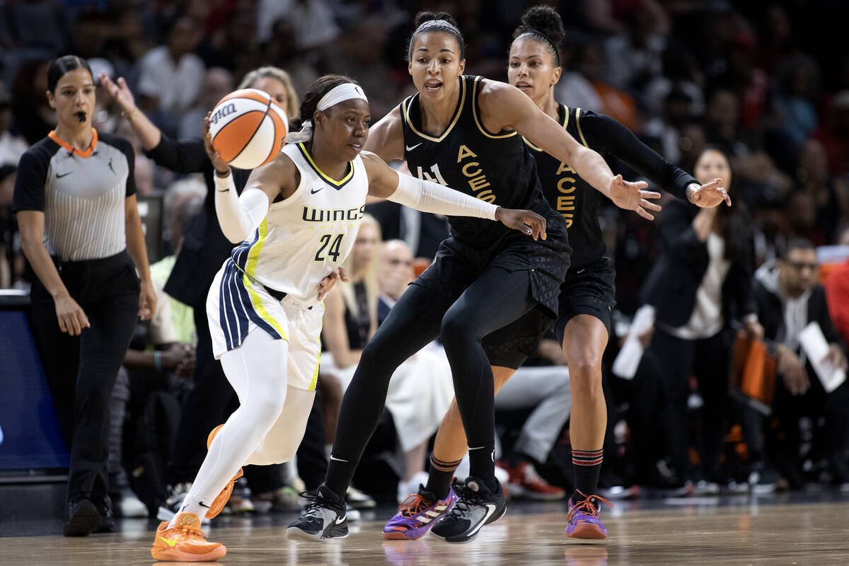 Las Vegas Aces center Kiah Stokes (41) and forward Alysha Clark, right, guard Dallas Wings guar ...