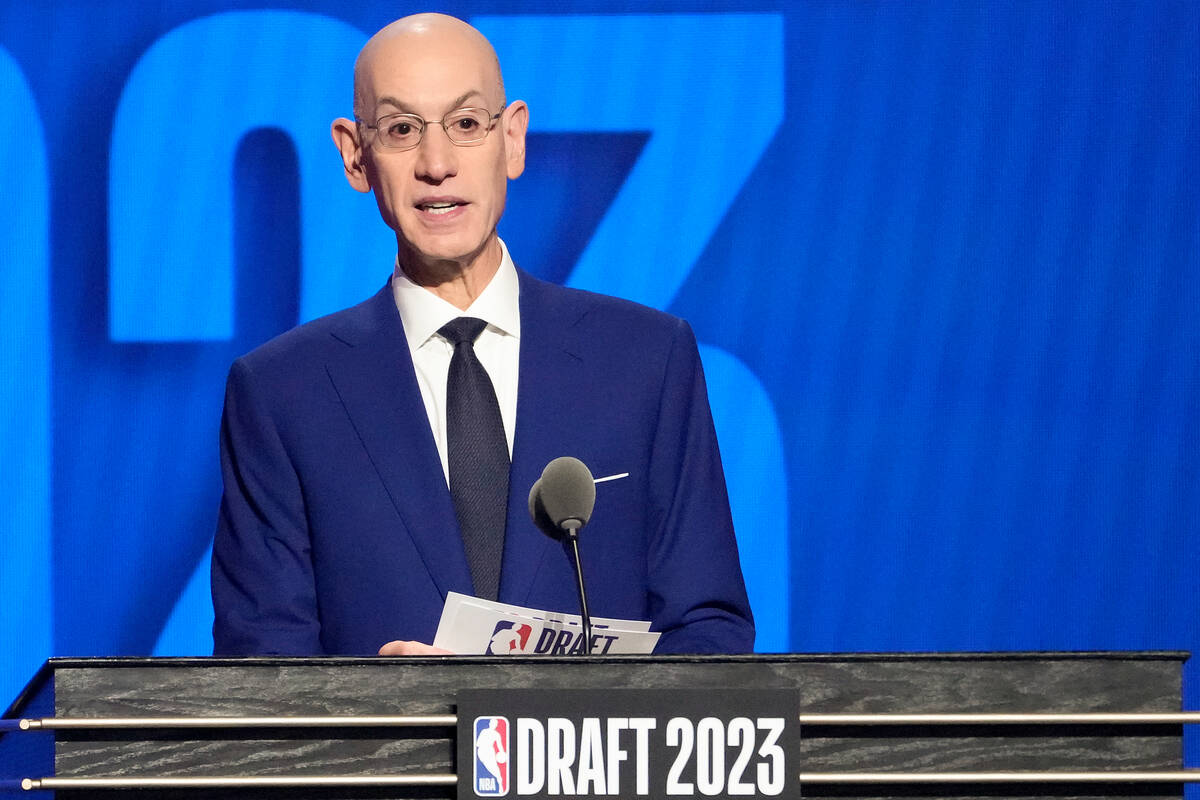 NBA Commissioner Adam Silver announces the 13th pick in the NBA basketball draft, Thursday, Jun ...