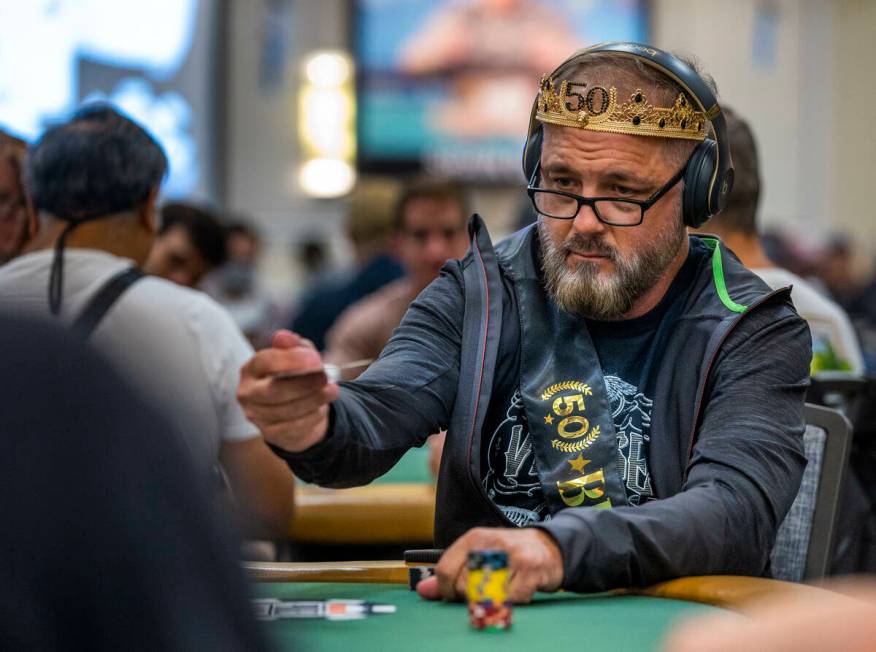 A player sports a crown during the final starting flight of World Series of Poker $10,000 buy-i ...