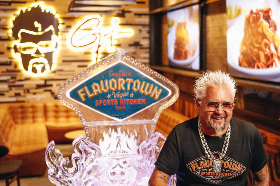 Guy Fieri laughs as he answers questions about his new restaurant on Friday, July 7, 2023, at G ...